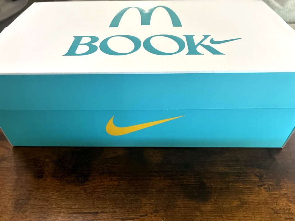 The sealed Book 2 × McDonald's box